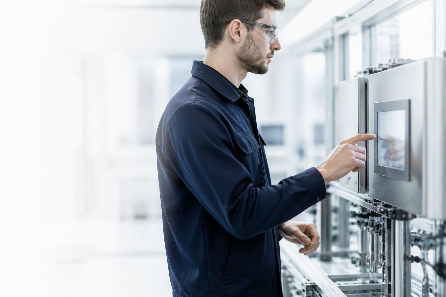 Engineer operating a modern industrial automation interface